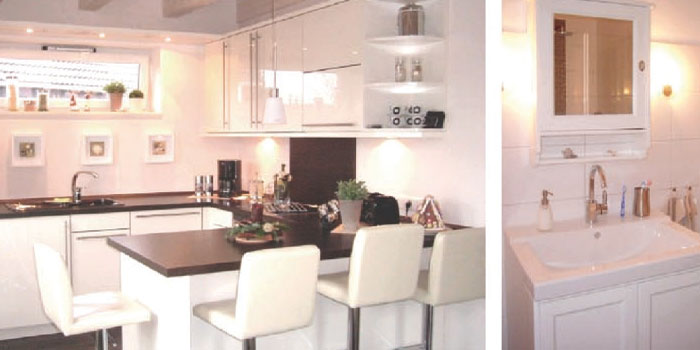 Haus-Kosel-Innenraum-Ansichten.-2jpg Haus-Kosel-Innenraum-Ansichten-offene Küche mit Tresen- Einblick in das Badezimmer